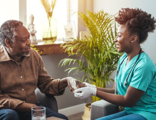 Black_male_patient_sitting_with_Black_clinician.original